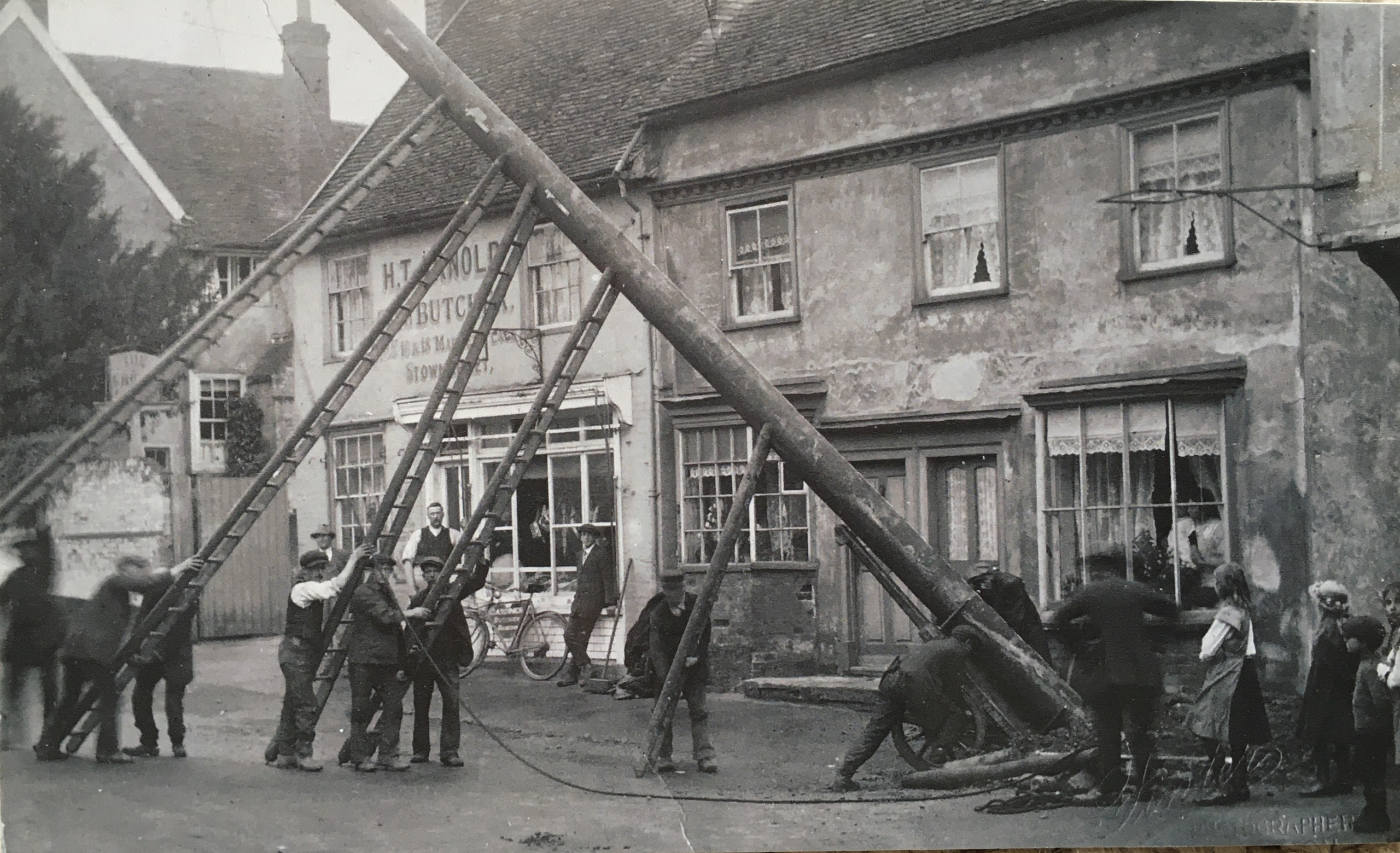 Telegraph pole being erected outside number 96 High Street